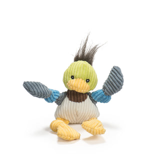Duck shaped plush dog toy: has brown hair, green head, black eyes, white pupils, yellow beak, brown neck, white stomach, gray-blue and blue knotted arms, with knotted yellow legs and feet.