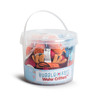 A plastic bucket with a lid and handle. It has a graphic with the name of the product "HuggleKats Water Critters". You can see through the plastic and are able to see the 12 cat toys, 3 lobster, 3 blue crabs, 3 orange crabs and 3 shrimp. In total there are 12 assorted toys in the bucket