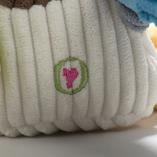 Close up image of the HuggleGroup heart that's on the back of durable plush corduroy duck dog toy.