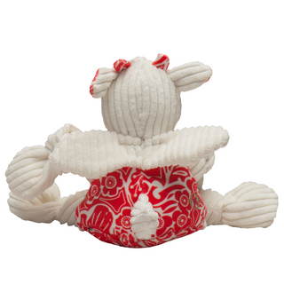 Back view of lucky dragon plush corduroy dog toy with white head, wings, tail, and knotted limbs, and red and white floral fabric on body and horns.