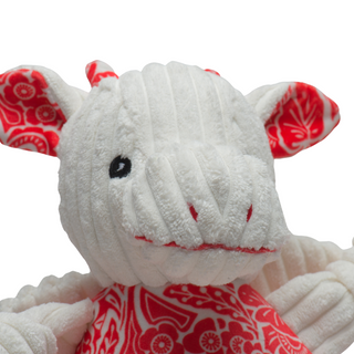 Close up of Lucky Dragon plush dog toy face to show details in embroidered facial features.
