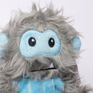 Close-up of Snobro's long gray faux-fur detailing, showing texture and softness of the toy's outer material.