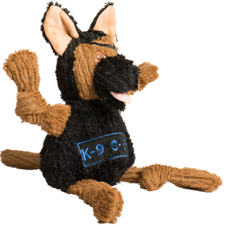 Photo of a black and tan German Shepherd dog toy. He has an eye patch over his left eye. On his belly his name, K-9 Chief, is embroidered. This is a side view. You can see his tan tail.