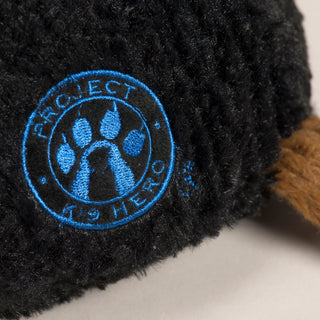 This picture is a close up of the logo for Project K-9 Hero. The embroidery is done using blue thread.