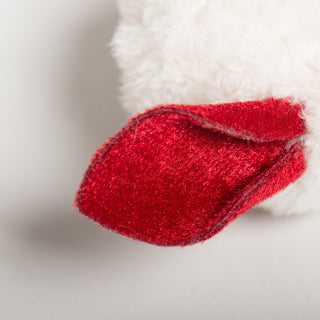 Detailed view of red felt mouse ear on the white HuggleKats plush toy.