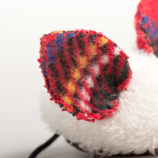 Close-up of a tartan plaid mouse ear with red, blue, white, black, and yellow fibers from the HuggleKats Three Blind Mice cat toy set.