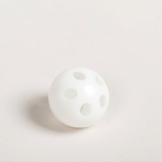 Close-up of a white plastic rattle ball insert used inside the HuggleKats mice.