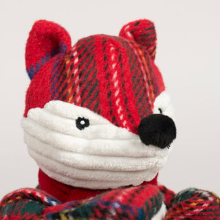 Close-up of Tartan Tidings Fox Knottie® Face with embroidered eyes, black nose and white corduroy face with holiday tartan plaid top of head and ears.