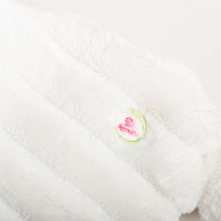 Heart embroidery stitched into tan corduroy body of Snowman HuggleFlattie.