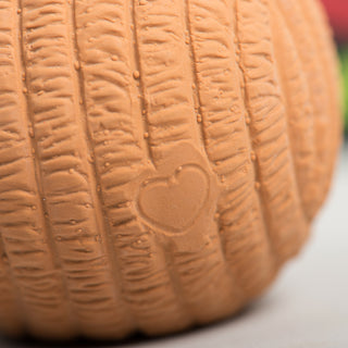 Embossed heart detail on the back of the brown Ruff-TexÂź gingerbread toy.