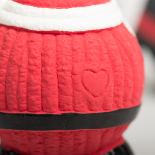Embossed heart detail on the back of a red Ruff-TexÂź Santa dog toy.