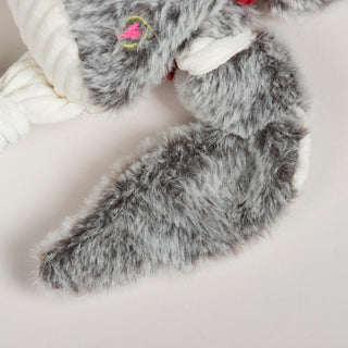 Side close-up of Ollie Owl Knottie's fluffy gray wing and embroidered heart