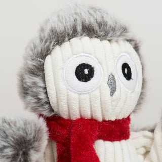 Close-up of Ollie Owl Knottie's embroidered eyes and fuzzy gray trim