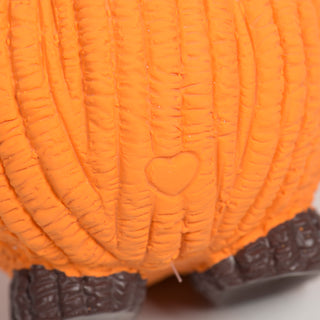 Close-up view of the small embossed heart detail on the back of the Gourdie Ruff-Tex pumpkin toy.