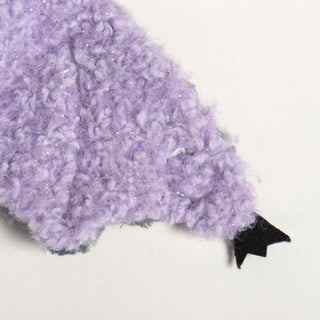 Detailed view of Baxter Bat's plush lavender wing with a scalloped edge and small black felt wingtip.