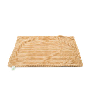 Natural colored scout blanket folded, and on the ground.
