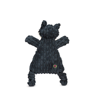 Back view of dark gray triangle shaped raccoon corduroy plush dog toy with white face, black inner ears and around eyes, dark gray strip down forehead, knotted legs, short stubby arms, and brown embroidered eyes.