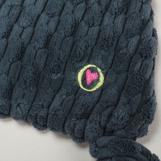 Close up of embroidered HuggleHeart logo on Reggie Raccoon.