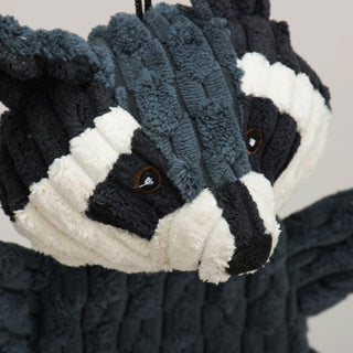 Close up of Reggie Raccoon's embroidered facial details.