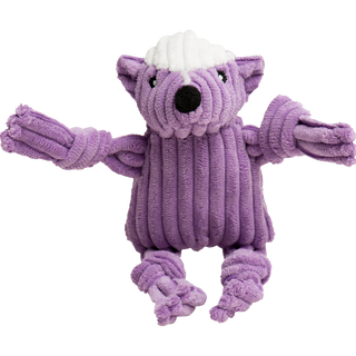 The picture is a close up of the corduroy purple skunk. His arms and legs are knotted. His nose is black. The top of his head is white and he has cute embroidered black eyes with white pupils.