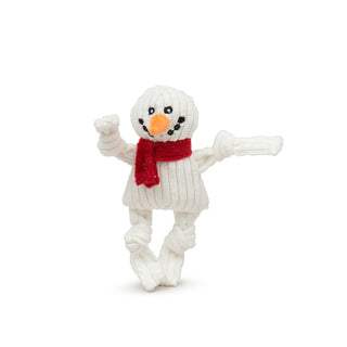 Snowman Wee Huggle plush corduroy dog toy with white body, head, and knotted limbs, red scarf, orange carrot nose, and black embroidered eyes and mouth.