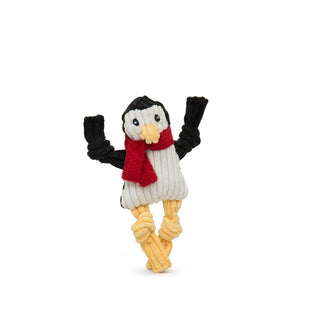 Penguin Wee Huggle with yellow knotted legs, black knotted arms and head, white stomach and face, yellow beak, red scarf, and black embroidered eyes.