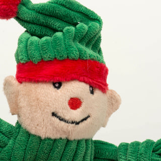 Close up of elf Wee Huggle's face to show details of fabric texture and embroidery details.