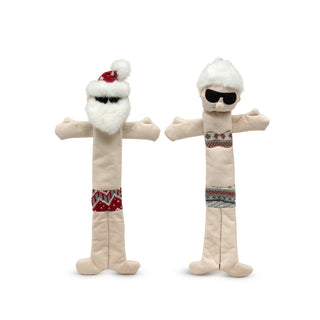 Set of two Beach Bum and Beach Babe Long and Lovelie™ plush dog toys with minimal stuffing: Stretched out Santa with pale skin tone body, red nordic swim trunks and hat, white fluffy beard, hair and hat details, and black embroidered sunglasses; Stretched out Mrs. C with gray nordic print bikini, fluffy white hair in a bun, and black sunglasses.