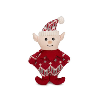 Elf cookie plush dog toy with red nordic print sweater and hat, red shoes and collar, white corduroy hat details and pouf, pale skin tone face with embroidered facial details.