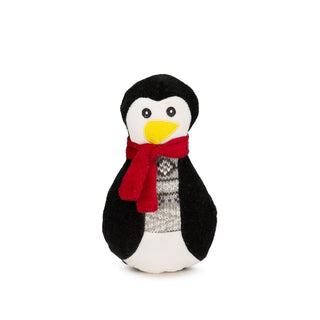 Penguin cookie plush dog toy with black and white body, grey nordic print sweater, red scarf, yellow embroidered beak and black embroidered eyes.
