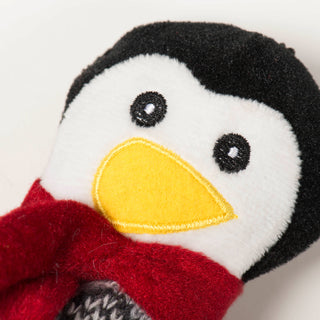 Close up of penguin cookie's face to show embroidery details on face.