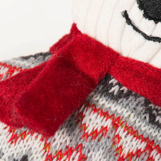 Close up of polar bear cookie's scarf to show different textures of different fabrics.