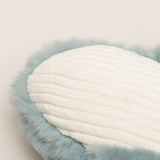 Close up of underside of toy to show texture of white corduroy fabric.