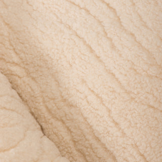 Close up view of sleeping area fabric to show soft texture.