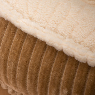 Close up view of where the khaki corduroy fabric meets the fleece fabric sleeping area to show texture of both fabrics.