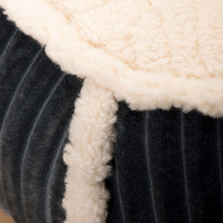 Close up view of where the steel blue corduroy fabric meets the fleece fabric sleeping area to show texture of both fabrics.
