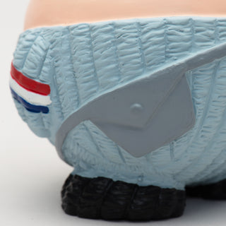 Close up view of gray mail bag on squeaky latex ball shaped, squeaky latex ball mail carrier dog toy.