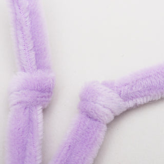 Close up image of purple knotted antennae.