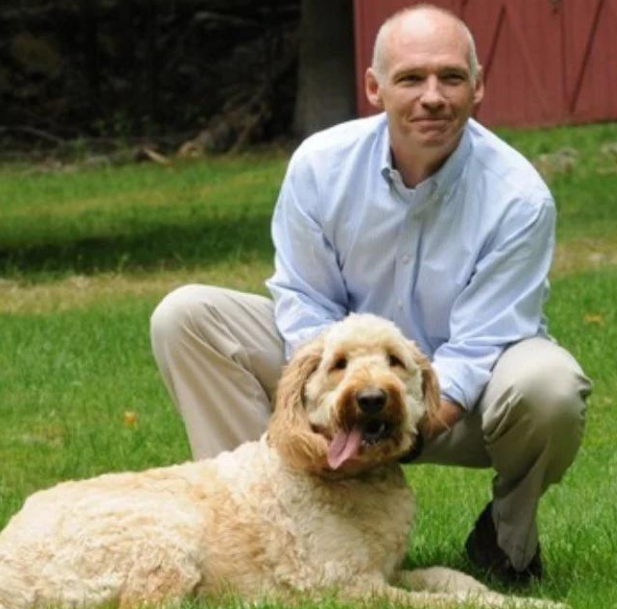 Bob Flynn, Co-Founder, posed with dog, Buddie.