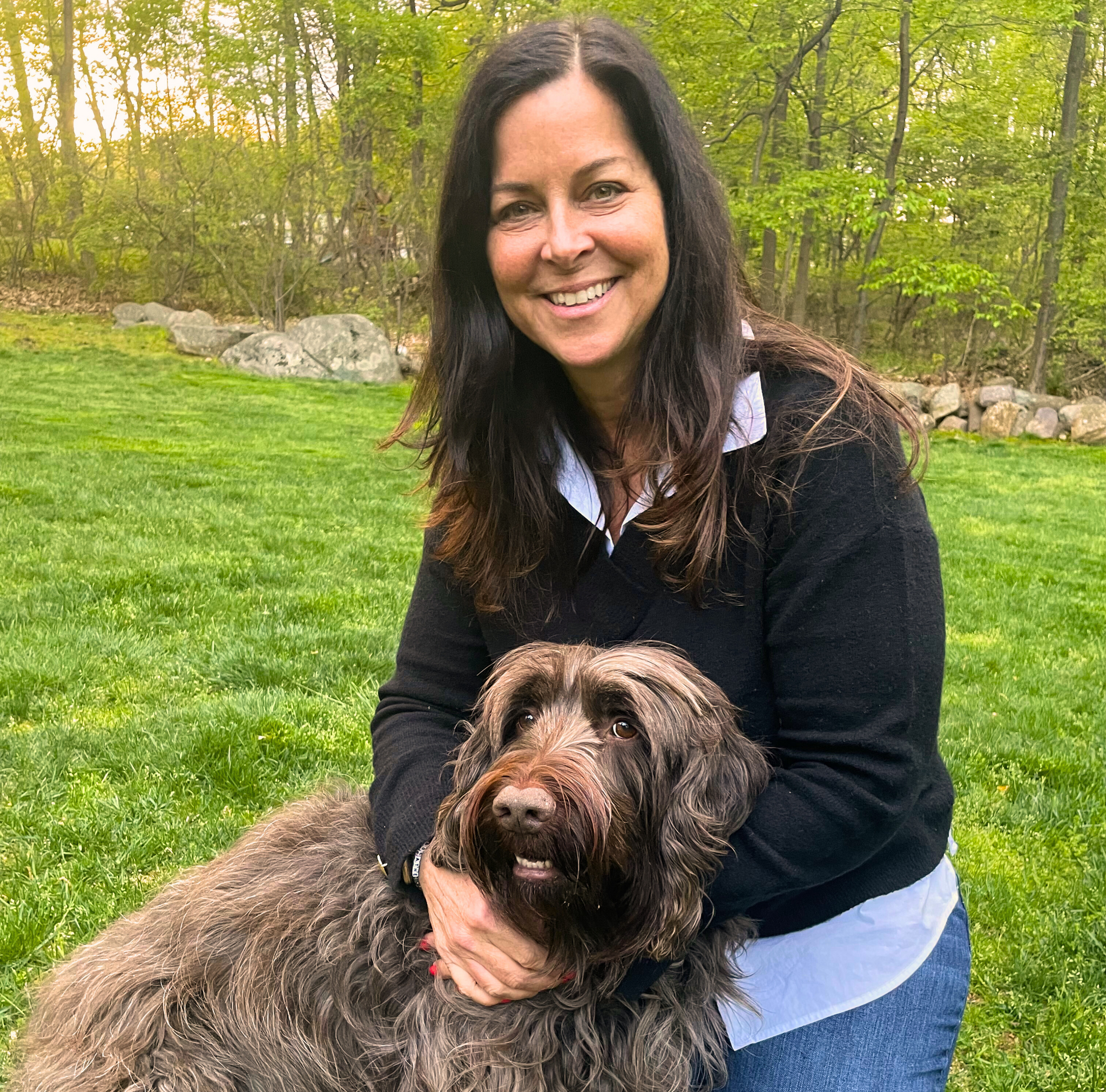 Maria Dalhausser, Trade Operations Specialist, posed with dog, Mabel.