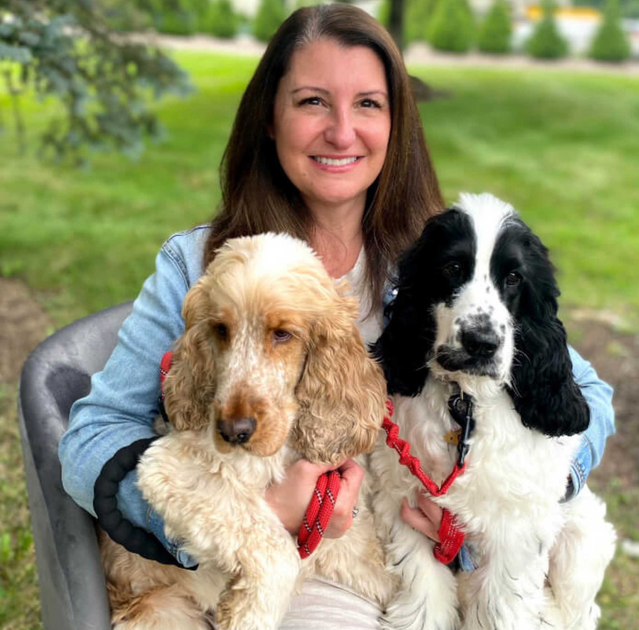 Theresa Brown, Product Development Manager, posed with two dogs, Hennessy and Stella