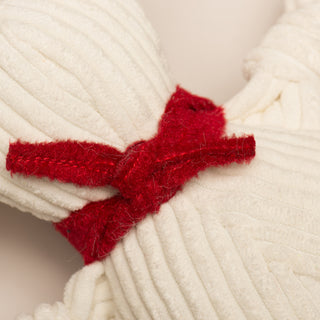 Close up image of the back of knotted red bandana around neck.