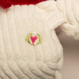 Close up image of the HuggleHeart logo on the back of Chihuahua mix plush dog toy.