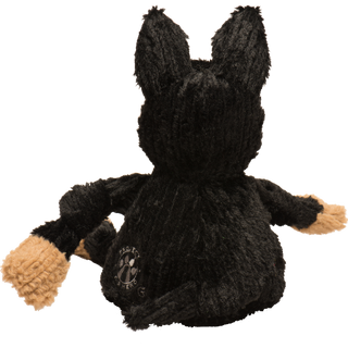 Back of black shepherd durable plush dog toy. Has black fur, knotted limbs, light-brown paws, black tail, project k-9 hero on lower left back, and is squeaky.