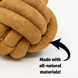 Close up of HuggleHide® Leather Ball with text "Made with all-natural materials!"