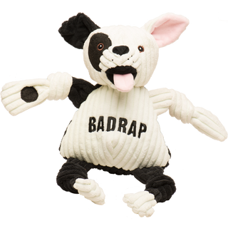 Jonny Justice durable plush corduroy dog toy: the dog has white and black fur, white left ear, black right ear, black right outer-eye, with brown eyes, white pupils, a plush-out black nose, and mouth. has a black and white furred right arm, the word "BadRap" across the chest, black furred legs, white paws, and is squeaky with knotted limbs.