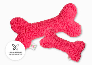 Living Beyond Breast Cancer logo next to hot pink HuggleFleece® bones
