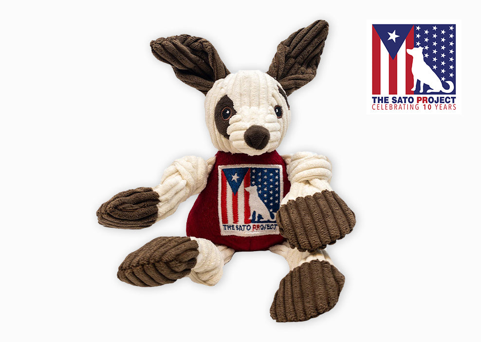 The Sato Project logo next to tan and brown plush Knottie® dog.