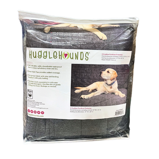 Charcoal quilted waterproof jersey furniture protector inside of clear zippered packaging.