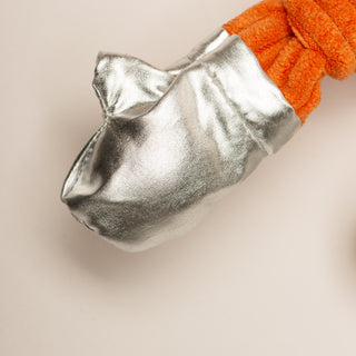 Close up of silver glove on Astronaut durable plush dog toy.